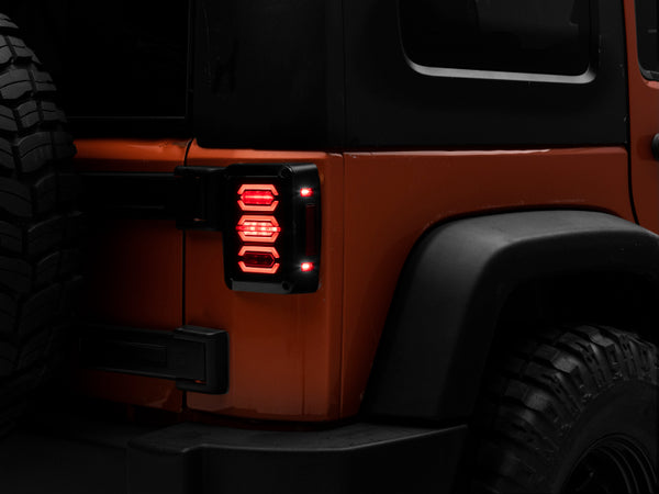 Raxiom 07-18 Jeep Wrangler JK LED Tail Lights- Black Housing (Smoked Lens) - J106751 for 2007-2018 Jeep Wrangler - front view