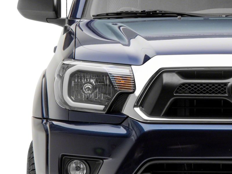Raxiom 12-15 Toyota Tacoma Axial Series Headlights w/ LED Bar- Blk Housing (Clear Lens) - TT21847