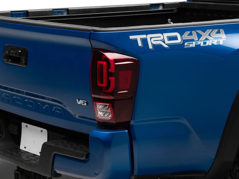 Raxiom 16-23 Toyota Tacoma XW Series Sequential LED Tail Lights- Black Housing- Red Lens - TT30332 - front view