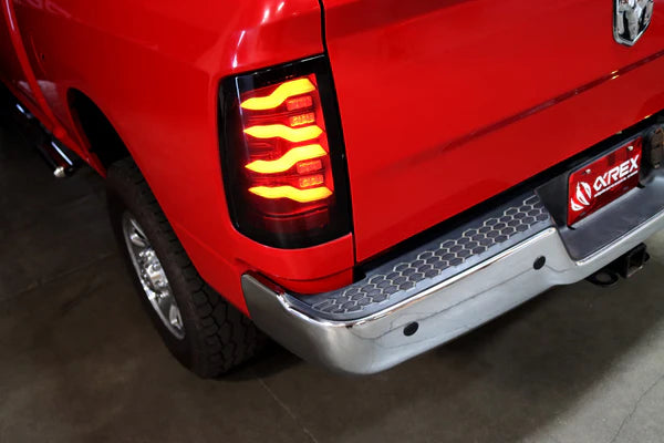 AlphaRex 09-18 Dodge Ram Luxx-Series LED Tail Lights Black w/ Activation Light &amp; Sequential Signal - 640004
