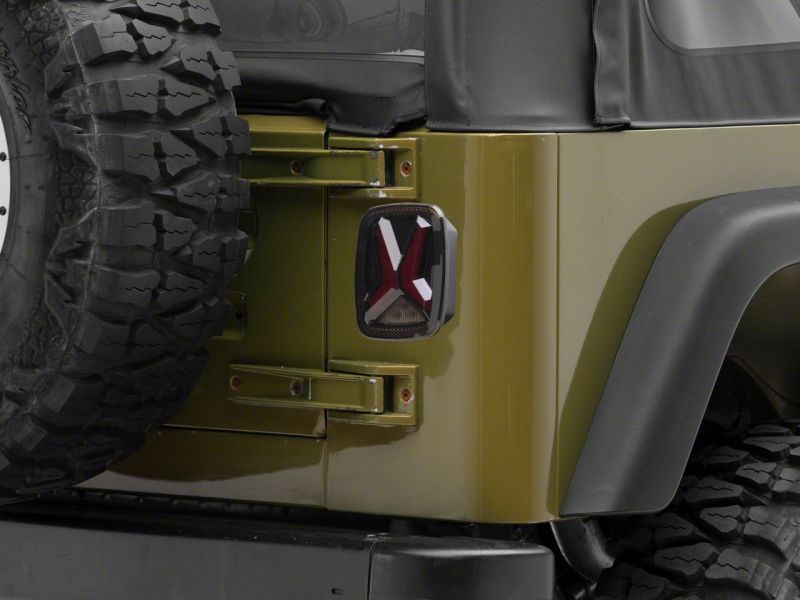 Raxiom 76-06 Jeep CJ7 Wrangler YJ &amp; TJ Gladiator LED Tail Lights- Blk Housing (Smoked Lens) - J177410