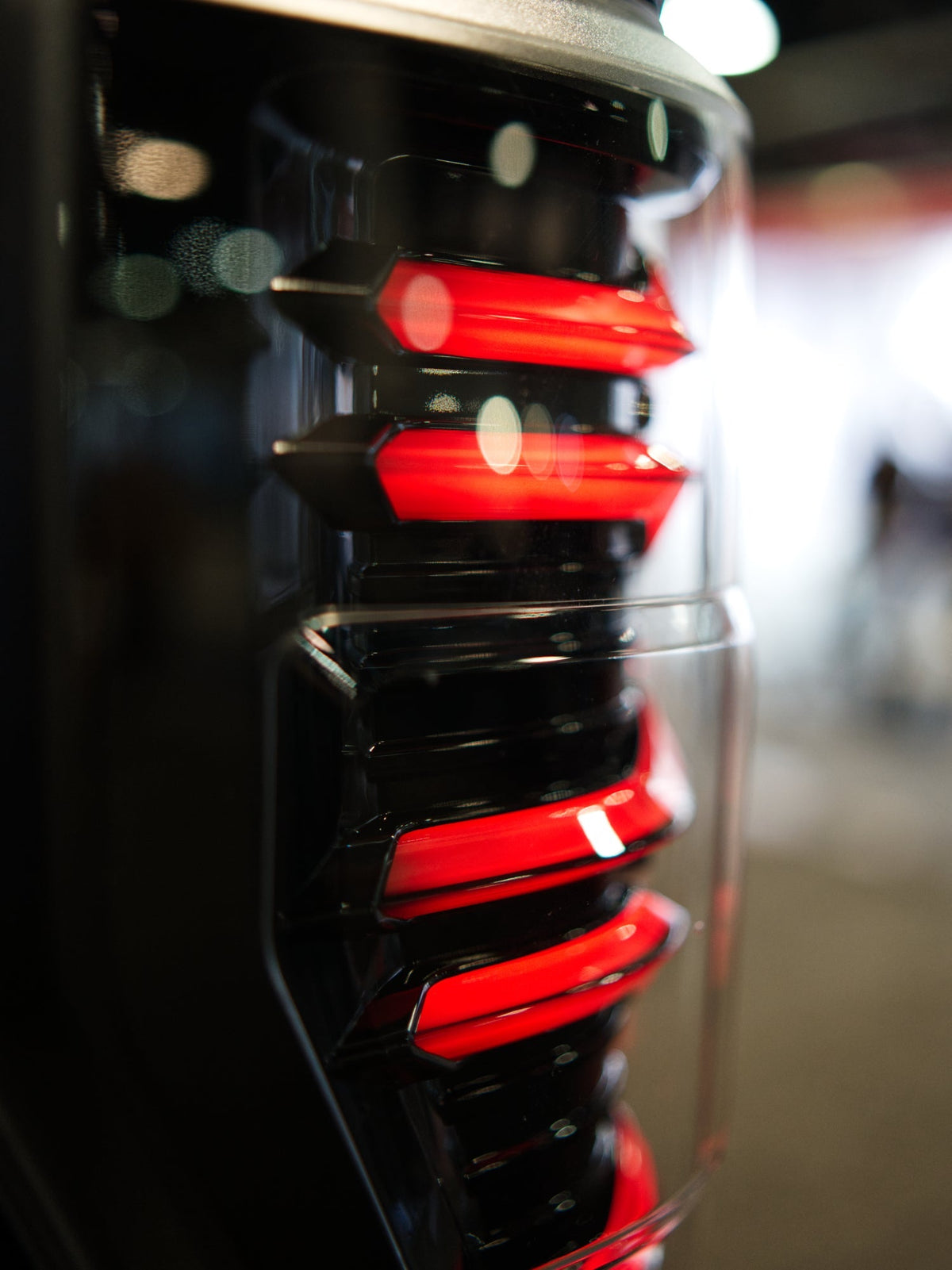 AlphaRex 17-19 Ford F150/F250/F350 LUXX LED Taillights - Black-Red - 659092 for 2017-2019 Ford F 150 - side view