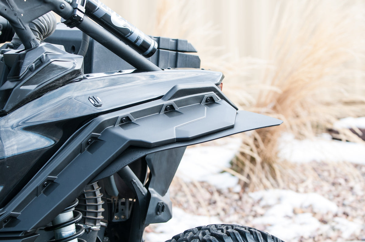 RokBlokz fender extensions installed on a 2017+ Can-Am Maverick X3 with BRP fenders, providing protection from mud and debris - rear