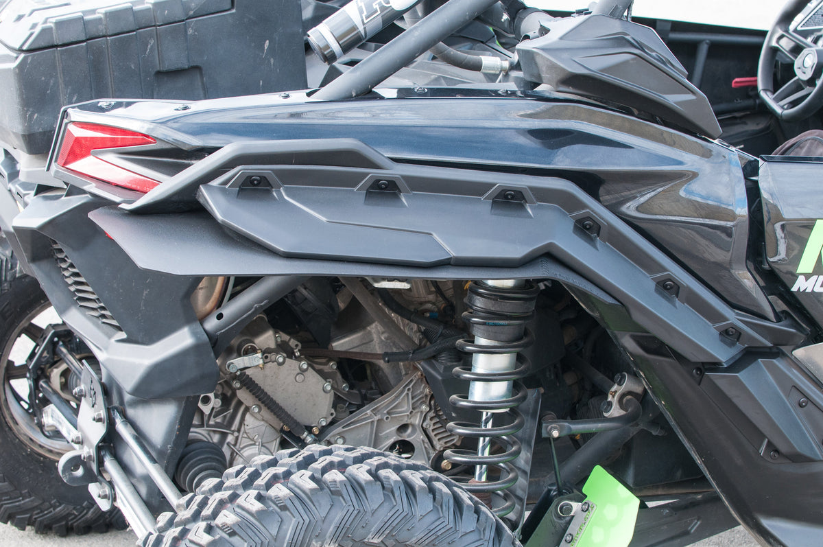 RokBlokz fender extensions installed on a 2017+ Can-Am Maverick X3 with BRP fenders, providing protection from mud and debris - rear 2