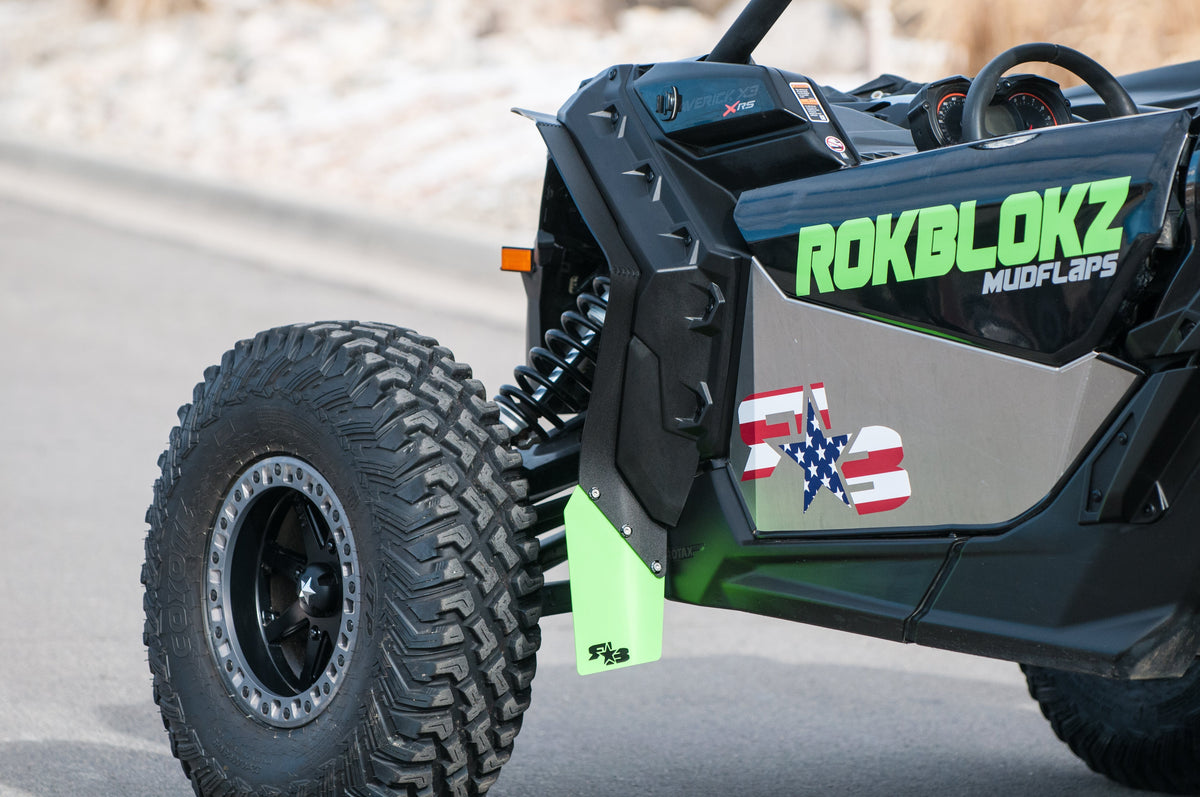 RokBlokz fender extensions installed on a 2017+ Can-Am Maverick X3 with BRP fenders, providing protection from mud and debris - front 3