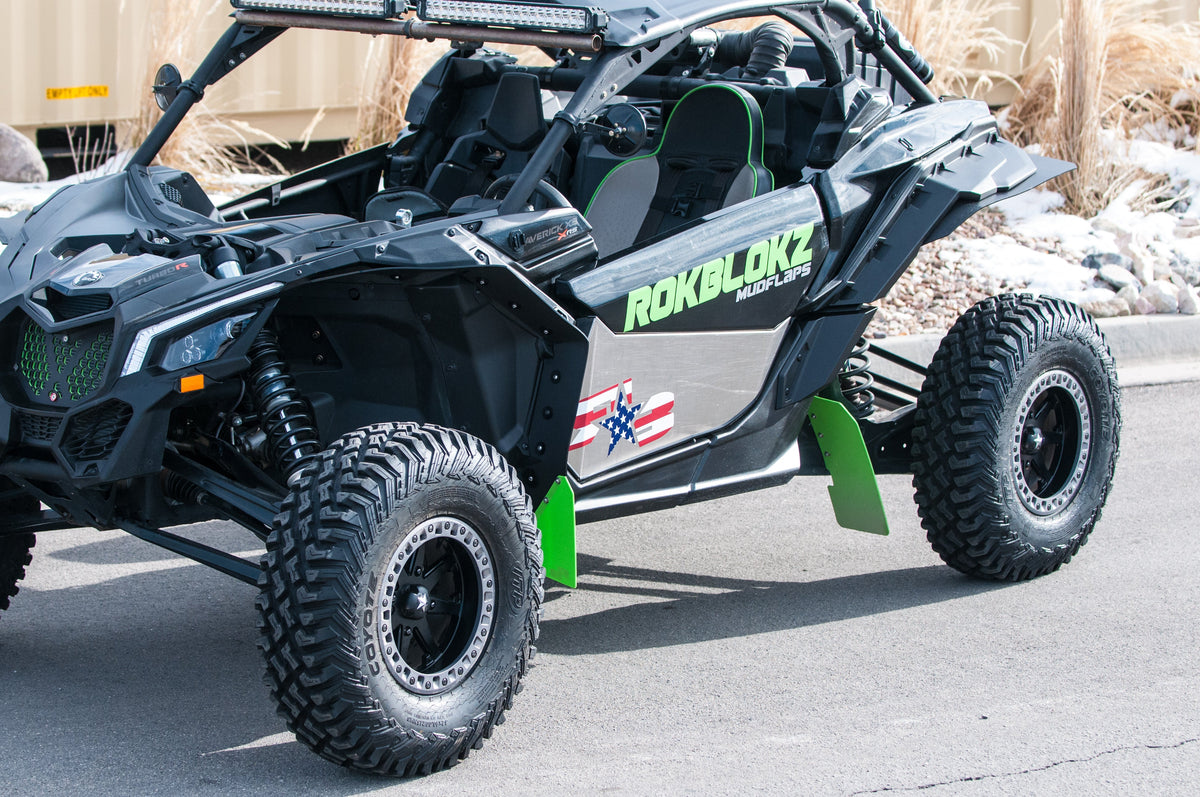 RokBlokz fender extensions installed on a 2017+ Can-Am Maverick X3 with BRP fenders, providing protection from mud and debris - driver side
