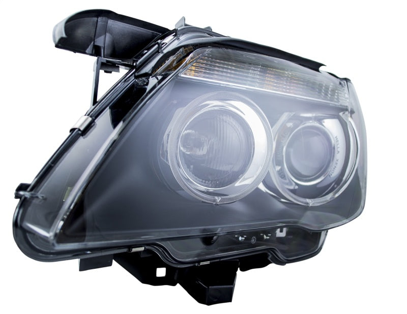 Hella 02-07 BMW 7 Series Bi-Xenon Headlight Left Clear Turn Signal - 009044531