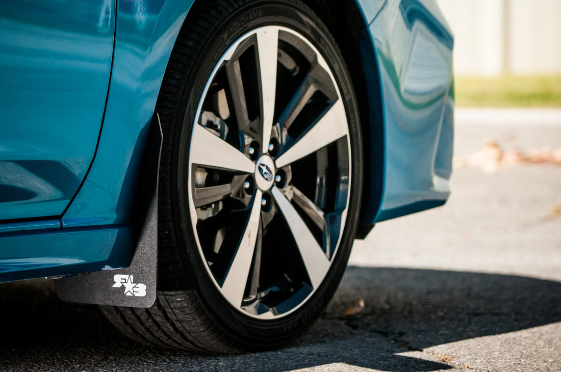 17 Impreza featuring Rokblokz Mud Flaps in Black w/ White logo Original 