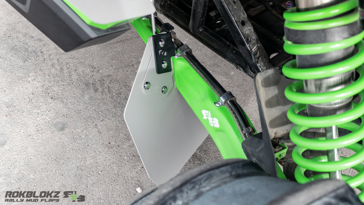 Detail of Rokblokz polymer trailing arm flap mounted on Teryx H2 trailing arm