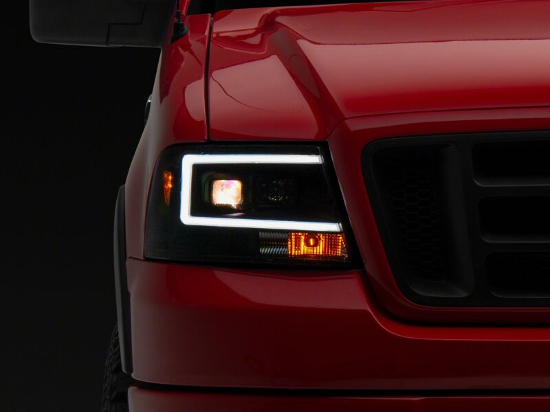 Raxiom 04-08 Ford F-150 Axial Series Projector Headlights- Black Housing- Clear Lens - T569352 - detail view