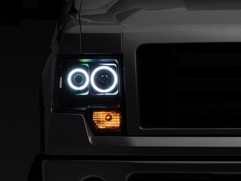 Raxiom 09-14 Ford F-150 Super White LED Halo Projector Headlights- Blk Housing (Clear Lens) - T542825