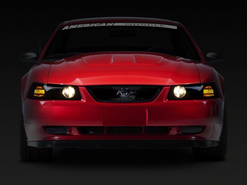 Raxiom 99-04 Ford Mustang Axial Series Projector Headlights- Blk Housing (Smoked Lens) - 49126