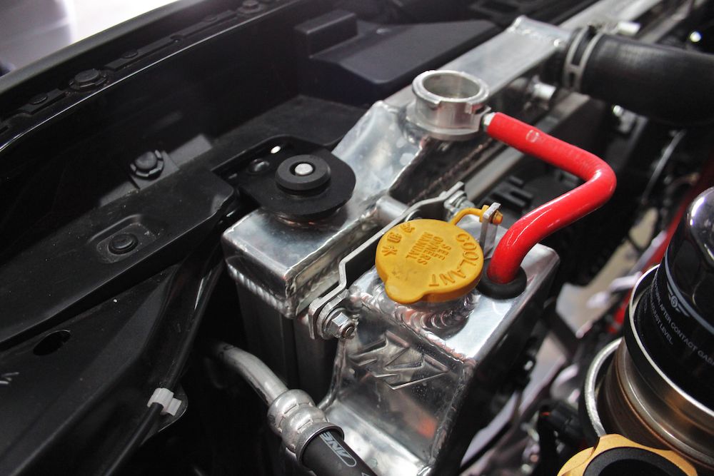 Mishimoto 08+ Subaru WRX/STI Polished Aluminum Coolant Overflow Tank - MMRT-STI-08 for 2008-2014 Subaru Impreza - angle view
