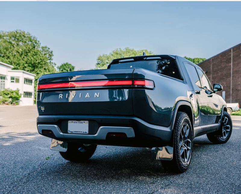 Rally Armor 22-24 Rivian R1T Black UR Mud Flap w/Tangerine Scream Logo - MF18-UR-BLK/TS