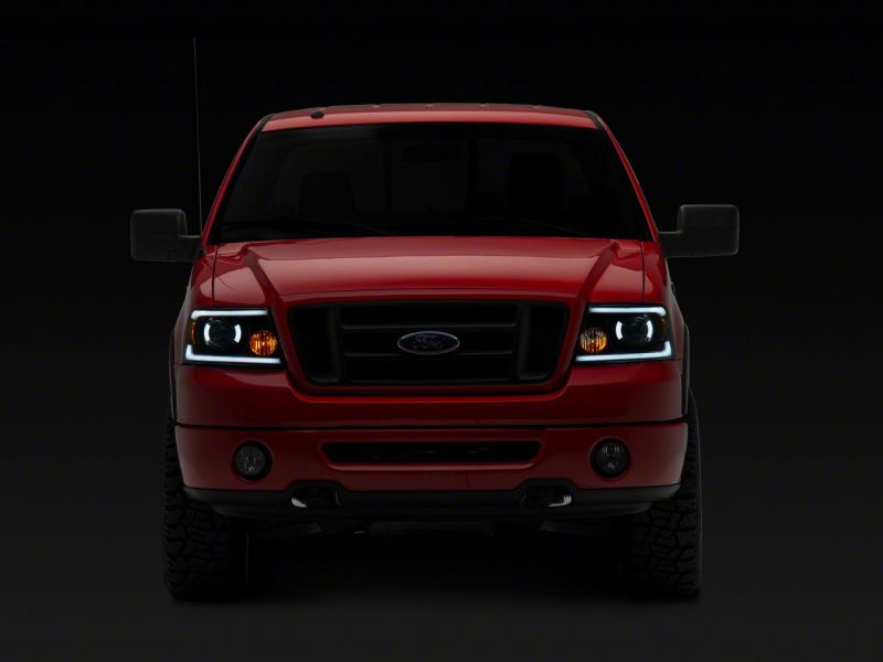 Raxiom 04-08 Ford F-150 Axial Series Projector Headlights w/ SEQL LED Bar- Blk Housing (Clear Lens) - T566364