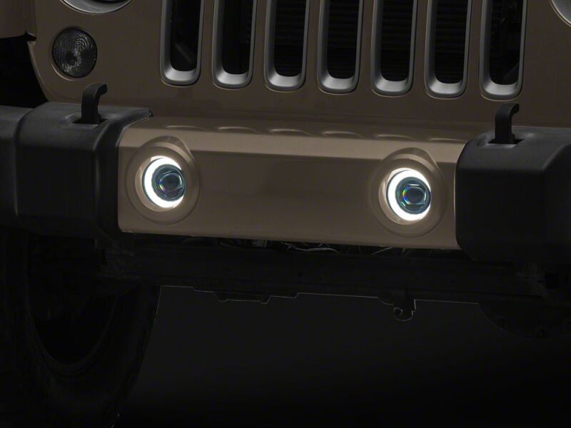 Raxiom 07-18 Jeep Wrangler JK V2 LED Switchback Fog Lights with Amber Turn Signal and Halo Rings - J238999 - close-up view 2