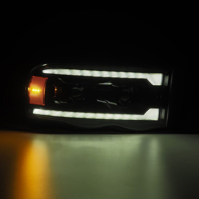 AlphaRex 02-05 Dodge Ram 1500 LUXX LED Proj Headlights Alpha Black w/Activ Light/Seq Signal - 880569