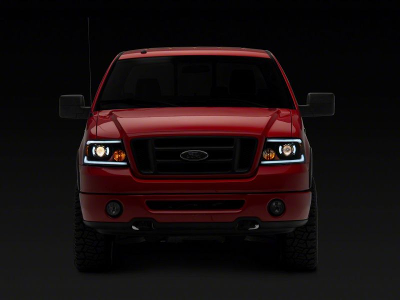 Raxiom 04-08 Ford F-150 Axial Series Projector Headlights w/ SEQL LED Bar- Blk Housing (Clear Lens) - T566364