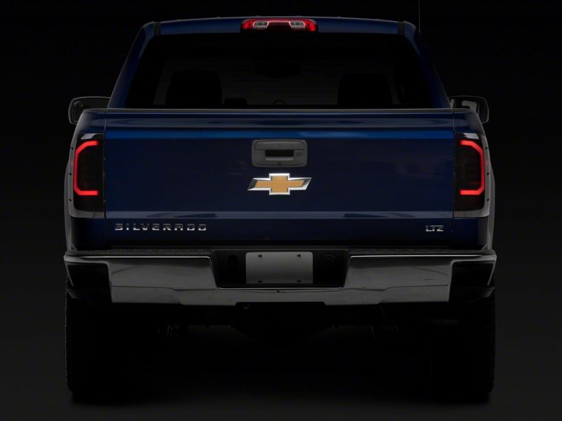 Raxiom 14-18 Chevrolet Silverado 1500 Axial Series LED Tail Lights- Blk Housing (Smoked Lens) - S151298