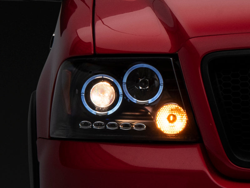 Raxiom 04-08 Ford F-150 Dual LED Halo Projector Headlights- Black Housing (Clear Lens) - T542827