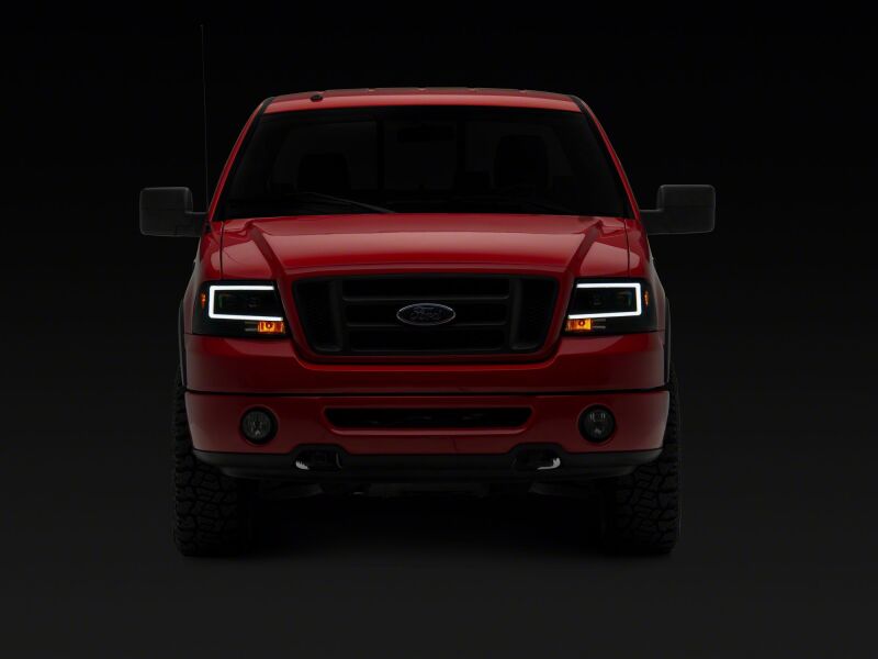 Raxiom 04-08 Ford F-150 Axial Series Projector Headlights- Black Housing- Clear Lens - T569352 - side view