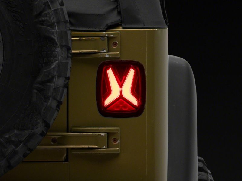 Raxiom 76-06 Jeep CJ7 Wrangler YJ &amp; TJ Gladiator LED Tail Lights- Blk Housing (Smoked Lens) - J177410