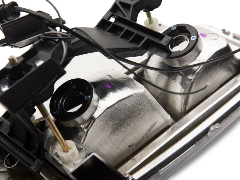 Raxiom 99-06 GMC Sierra 1500 Axial Series Headlights w/ LED Bar- Blk Housing (Clear Lens) - S531789