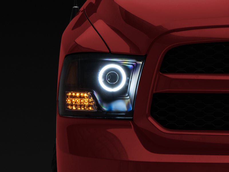 Raxiom 09-18 RAM 1500 Super White LED Halo Projector Headlights- Black Housing (Clear Lens) - R110150