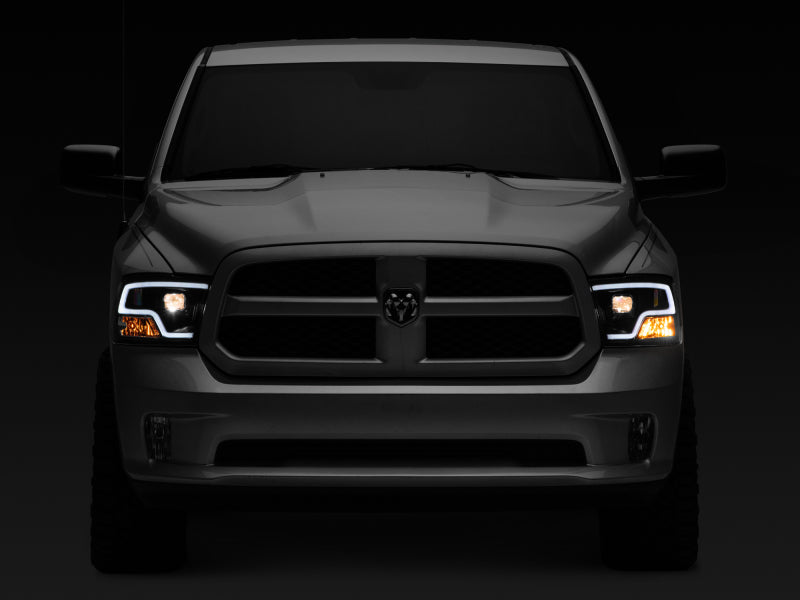 Raxiom 09-18 RAM 1500 LED Halo Projector Headlights- Black Housing (Clear Lens) - R111516