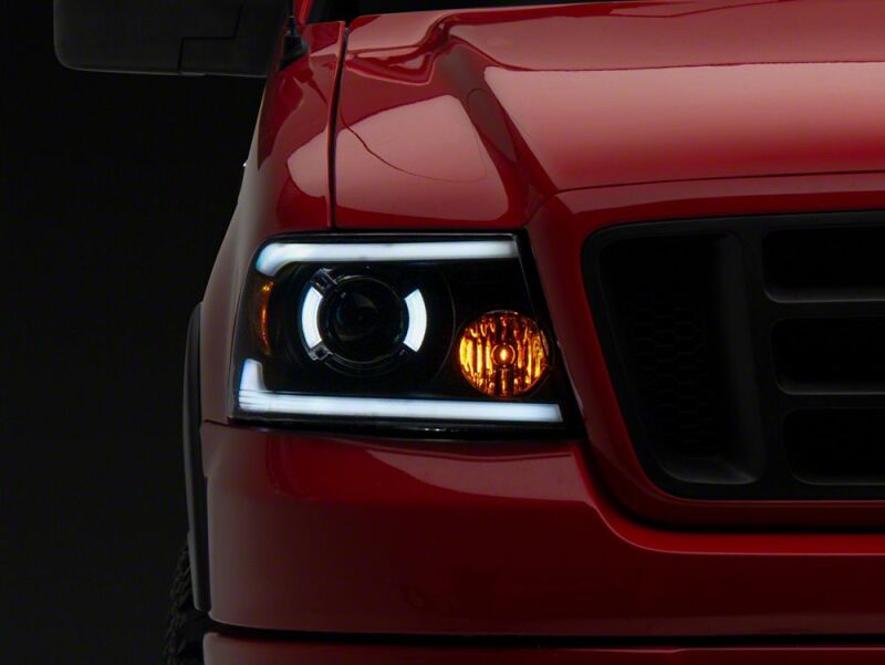 Raxiom 04-08 Ford F-150 Axial Series LED Proj Headlights/Seq LED Bar- Black- Clear Lens - T566366 - close-up view 5