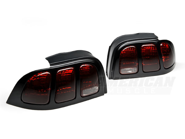 Raxiom 96-98 Ford Mustang Tail Lights- Black Housing (Smoked Lens) - 49124 for 1996-1998 Ford Mustang - front view