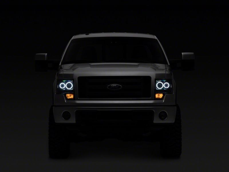 Raxiom 09-14 Ford F-150 Super White LED Halo Projector Headlights- Blk Housing (Clear Lens) - T542825