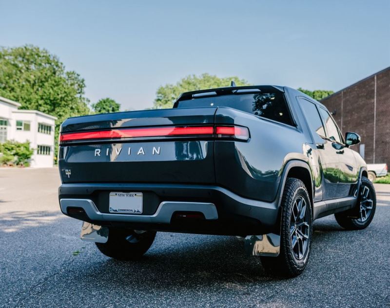 Rally Armor 22-24 Rivian R1T Black UR Mud Flap w/Tangerine Scream Logo - MF18-UR-BLK/TS