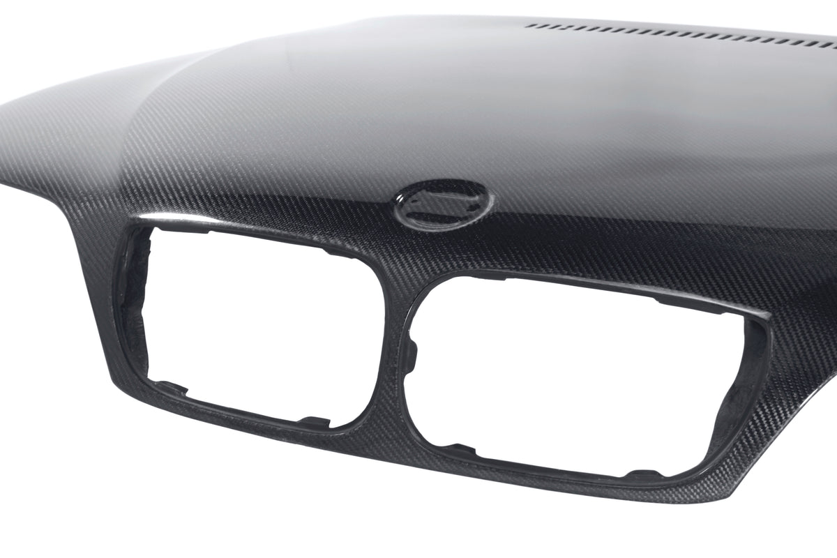 Seibon 02-05 BMW 3 Series 4dr E46 (Manuf Date 7/02-7/06 Models Only) OEM-Style Carbon Fiber Hood - HD0205BMWE464D-OE