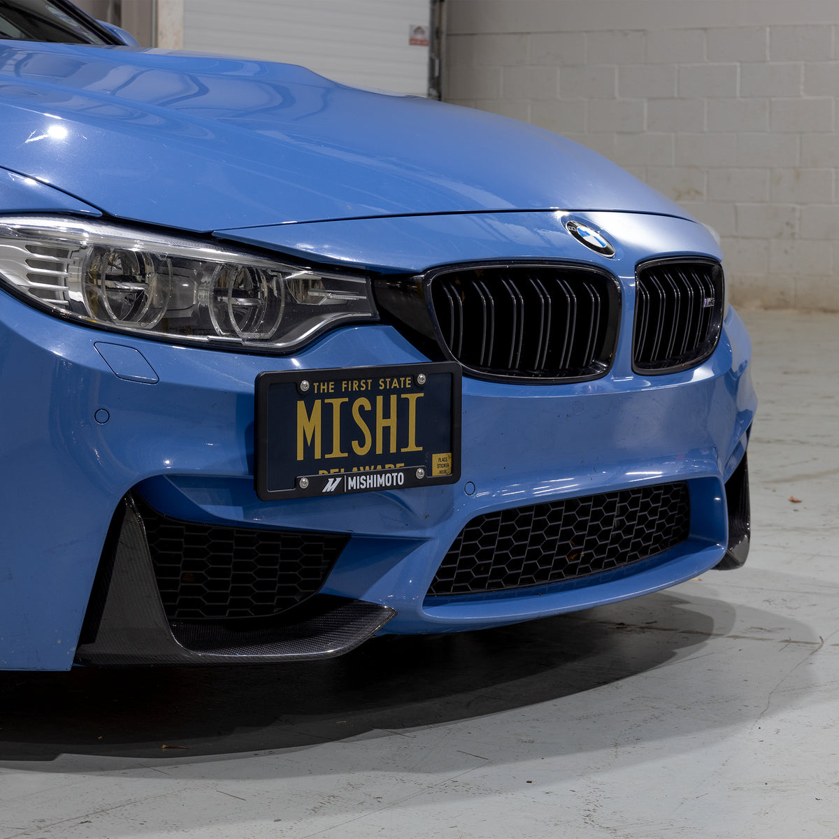 Mishimoto 15-20 BMW F8X M3/M4 License Plate Relocation Kit - MMLP-F80-15 for 2015-2020 BMW M4 - side view