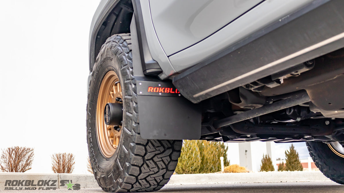 Rokblokz Step-Back Mud Flaps installed on 2020+ Chevy Silverado 2500HD Front wheel for extra tire clearance and paint protection