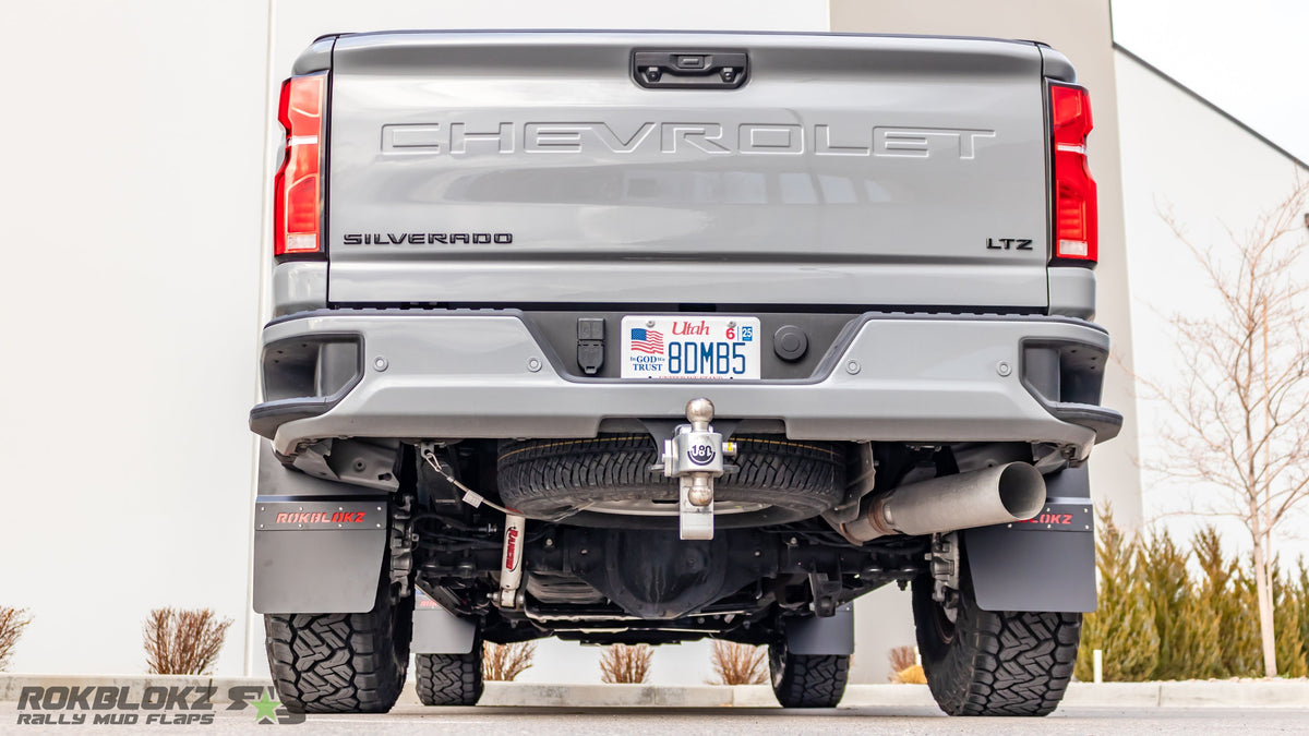 Rokblokz Step-Back Mud Flaps installed on 2020+ Chevy Silverado 2500HD rear for extra tire clearance and paint protection.