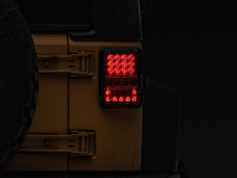 Raxiom 07-18 Jeep Wrangler JK Axial Series Lux LED Tail Lights- Blk Housing (Clear Lens) - J141596