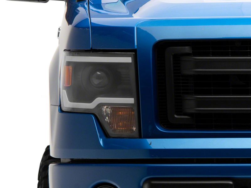 Raxiom 09-14 Ford F-150 Axial Series Projector Headlights w/ LED Light Bar- Blk Housing (Clear Lens) - T566369