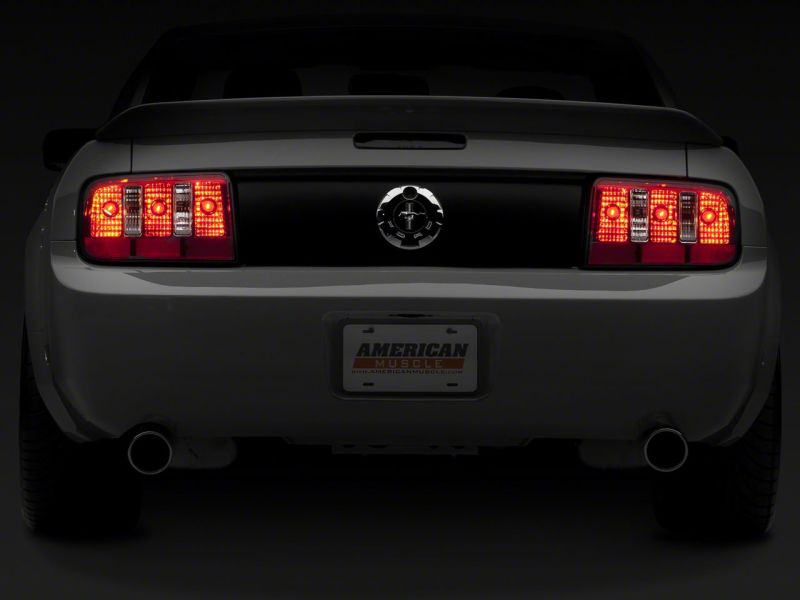 Raxiom 05-09 Ford Mustang Coyote Tail Lights- Chrome Housing - Red/Clear Lens - 49123