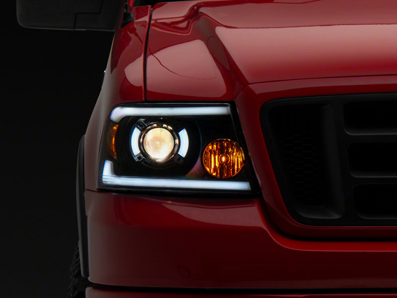 Raxiom 04-08 Ford F-150 Axial Series Projector Headlights w/ SEQL LED Bar- Blk Housing (Clear Lens) - T566364