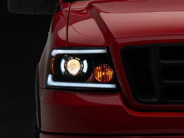 Raxiom 04-08 Ford F-150 Axial Series Projector Headlights w/ SEQL LED Bar- Blk Housing (Clear Lens) - T566364 for 2004-2008 F