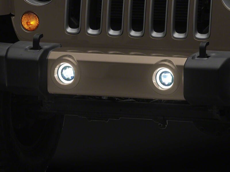 Raxiom 07-18 Jeep Wrangler JK V2 LED Switchback Fog Lights with Amber Turn Signal and Halo Rings - J238999 - close-up view 7