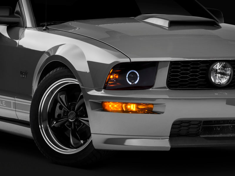 Raxiom 05-09 Ford Mustang Halogen 2010 Style LED Halo Headlights-Blk Hsng(Clear Lens/Excludes GT500) - 101682
