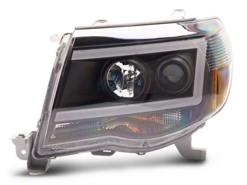 Raxiom 05-11 Toyota Tacoma Axial Series LED DRL Projector Headlights- Blk Housing (Clear Lens) - TT11236
