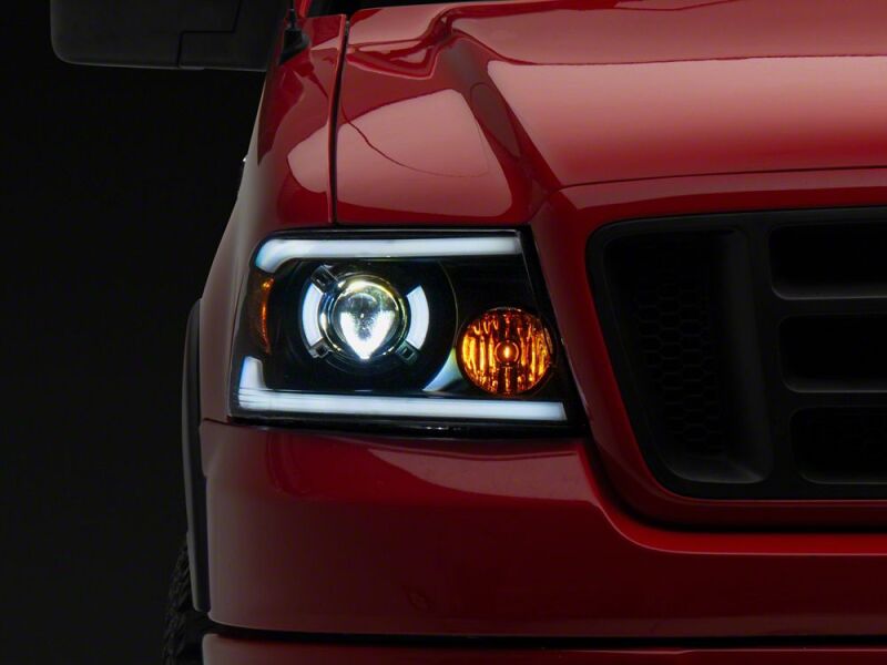 Raxiom 04-08 Ford F-150 Axial Series LED Proj Headlights/Seq LED Bar- Black- Clear Lens - T566366 - front view