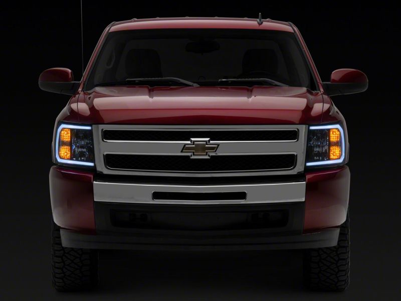 Raxiom 07-13 Chevrolet Silverado 1500 Axial Headlights w/ SEQL LED Bar- Blk Housing (Clear Lens) - S138004