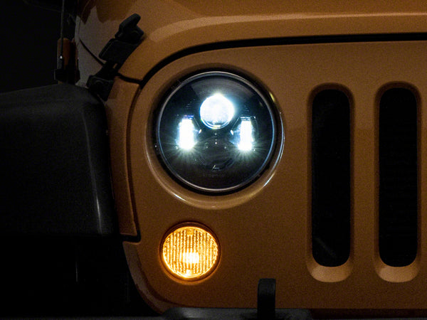 Raxiom 07-18 Jeep Wrangler JK 7-In LED Headlights- Blk Housing (Clear Lens) - J154695 for 2007-2018 Jeep Wrangler - front vie