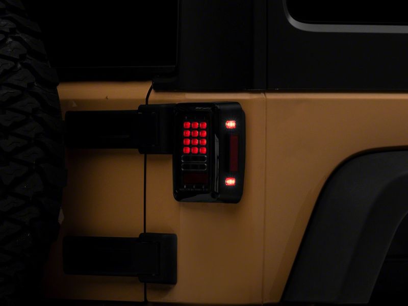 Raxiom 07-18 Jeep Wrangler JK Axial Series LED Tail Lights- Blk Housing (Clear Lens) - J141585