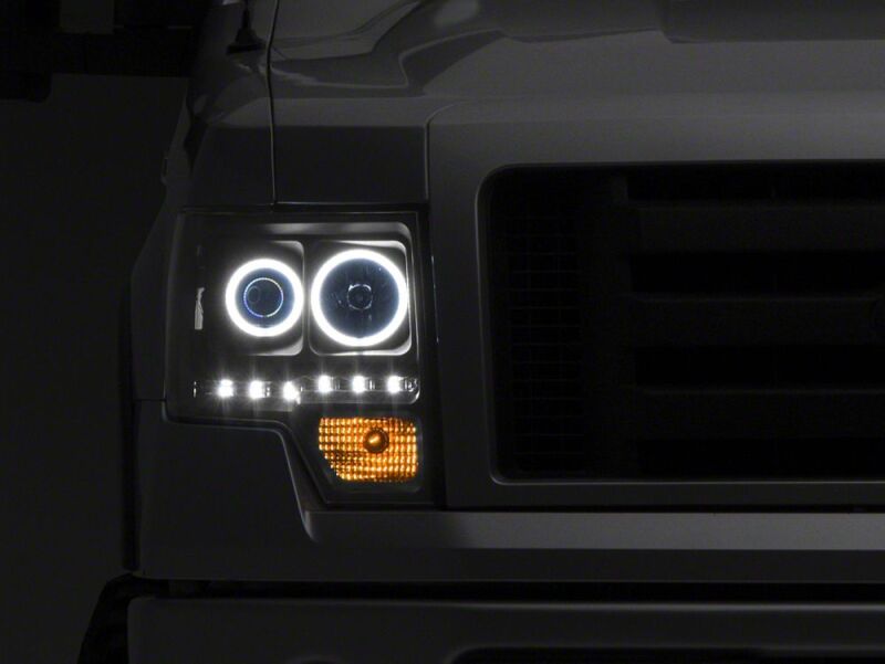 Raxiom 09-14 Ford F-150 G2 Super White LED Halo Projector Headlights- Black Housing- Clear Lens - T542835 - close-up view 10
